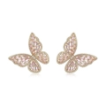 Macro detail of butterfly stud earrings featuring pink zircon and rose gold plating - 14K Gold Pink Zirconia