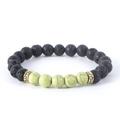 Natural lava rock and green stone beaded bracelet with stylish gold tone spacer charms. - Emperor Stone