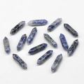 Blue and white sodalite natural stone double point hexagonal columns on white background - Blue Spot Jasper