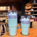 Mint green 20oz and 30oz insulated stainless steel tumblers with straw on a cafe table - 20oz/600ml / Screw Lid Straw Style / Green