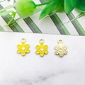 Detailed close-up of yellow enamel cherry blossom alloy pendants with gold-plated finish - 8x11mm / Yellow