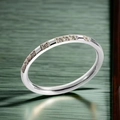 Minimalist silver titanium steel ring featuring elegant rows of sparkling white zircons - US 5 / Eternity Band Style / Silver