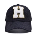 Detail of distressed mesh baseball cap featuring a sequined letter H patch and worn texture - Letter H Style (H-漏洞马尾棒球帽)