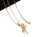 Close-up of golden bow pendant necklace with micro-paved zircons and lobster clasp - Pendant And Necklace (3)