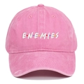 Close-up of pink washed baseball cap with ENEMIES embroidery and colorful dots - Pink