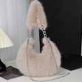 Detail of beige faux fur crescent bag with silver metal chain and soft plush texture - Apricot