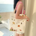 Off-white canvas tote bag featuring autumn hedgehog and mushroom hand-drawn prints - Autumn Leaves - Beige