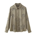 Detailed view of olive green satin shirt featuring intricate sequin and bead embroidery - XS / Tops / Green