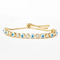Adjustable gold evil eye bracelet with blue charms and sparkling cubic zirconia stones - White