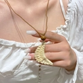Close-up of bohemian crescent moon woven pendant with dark wooden bead on brown cord - Crescent-shaped Wood Bead Woven Necklace (DZ-307)