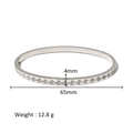 Detail showing a 4mm wide silver bangle with geometric serrated pattern and tiny cubic zirconia - Sawtooth Wave Style (HF-B5176-S)