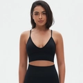 Detailed front view of seamless black V-neck sports bra and high-waisted leggings set - S / Black