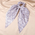 Close-up of silk ribbon scrunchie with blue evil eye pattern on golden fabric - 10# Light Pink Multi-Pattern