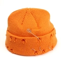Close-up of bright orange knitted beanie with distressed holes and silver metal ring accents - M (56-58cm) / Orange