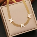 Golden mesh chain necklace with three white butterfly charms displayed on a beige gift box - 1# Necklace / Gold