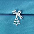 Silver bow and Christmas tree stud earring in sparkling rhinestones on blue fabric - Christmas Tree Style