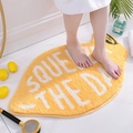 Absorbent lemon-shaped flocking bathroom mat with Squeeze the Day slogan in yellow - Lemon