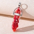 Macro shot of red stone-filled hexagonal crystal pendant with silver metal bail clasp - Resin Bright Red