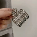 Elegant silver metal ponytail clip with multi-layer wrap design for women's hairstyling - Silver