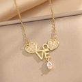 Golden heart necklace with LOVE letter pendant and zircon accents on beige fabric - Gold Heart LOVE Style (433) / Gold
