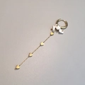 Detail of gold drop earring with white natural stones and four heart charms on a long chain - White Turquoise