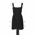 Detail view of black backless mini dress with ruffle trim and long tie-back ribbons - S / Black