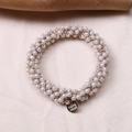 Detail of beaded pearl hair tie with gold 'Hand Made' charm on elegant satin fabric - Small Pearl