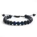 Adjustable tiger eye and black volcanic stone braided bracelet on a white background - Blue Tiger Eye + Lava Stone (NR12-3)