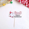 Macro detail of Santa Claus cake topper with red Merry Christmas text on wood stick - Style K Happy Christmas