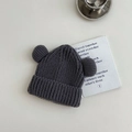 Close-up of a dark grey knit hat for kids featuring cute bear ears and textured fabric - 3-8 Years / Gray