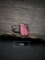 Detail view of July pink raw gemstone set on a vintage dark metal adjustable open ring - July - Rhodochrosite