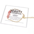 Detail of pink crystal chips on gold chain bracelet with lobster clasp and extension - Watermelon red
