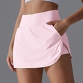 Detail view of pink high-waisted tennis skirt showing hidden pocket and side slit - Rose Pink