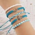 Set de 5 pulseras bohemias con cuentas azules, colgante de tortuga y detalles de olas - Pulsera / Azul