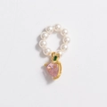 Detail of faux pearl necklace featuring a pink heart gemstone pendant with gold accents - Pendant-Peach