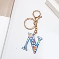 Golden keychain with letter N featuring colorful abstract patterns and lobster clasp - Letter N (No Tassel)