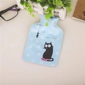 Mini hot water bottle in light blue with white polka dots and a cute cartoon cat print - Cat