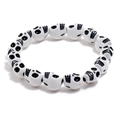 Retro white skull beaded bracelet with black detailing on a minimalist white background - White