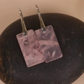 Detail of rectangular rose quartz drop earrings with silver hooks on dark stone - Rose Quartz Silver Hook