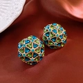 Macro shot of vintage style earrings with blue and green crystals on brown silk - Hemispherical Geometric Splicing Gem Style
