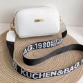White faux leather crossbody bag with wide logo fabric strap and gold hardware - White