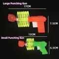 Extendable boxing glove gun toy in orange and green variants with size measurements - Small Fist Gun Toy
