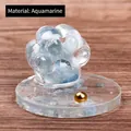 Aquamarine crystal cat paw figurine with golden bead on a round transparent base - Aquamarine