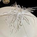 Detail of white goose feather hair clip with faux pearls, lace petals and beaded tassels - Duckbill Hair Clips / White