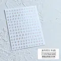 Detailansicht der roségoldenen 3D-Nagelsticker mit Buchstaben und selbstklebender Rückseite - 1141 Roségold