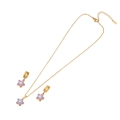 Golden necklace and earring set with purple star pendants in polished stainless steel - Star Style