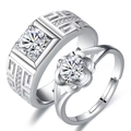 Close-up of silver couples rings with geometric textures and round diamond settings - Domineering Plum Blossom