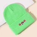 Macro detail of three embroidered mushrooms on a neon green ribbed knit beanie hat - Fluorescent Green