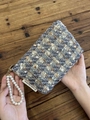 Tweed cosmetic bag with pearl handle featuring blue and gold woven fabric textures - Tweed Blue Gray