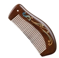 Detailed view of sandalwood massage comb featuring peacock inlay and deep wood grain - Painted Peacock